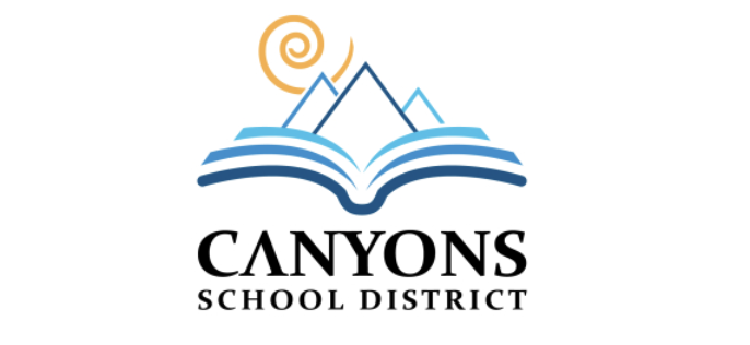 Canyons School district logo. Open book with mountains coming from the center and a yellow swirl.